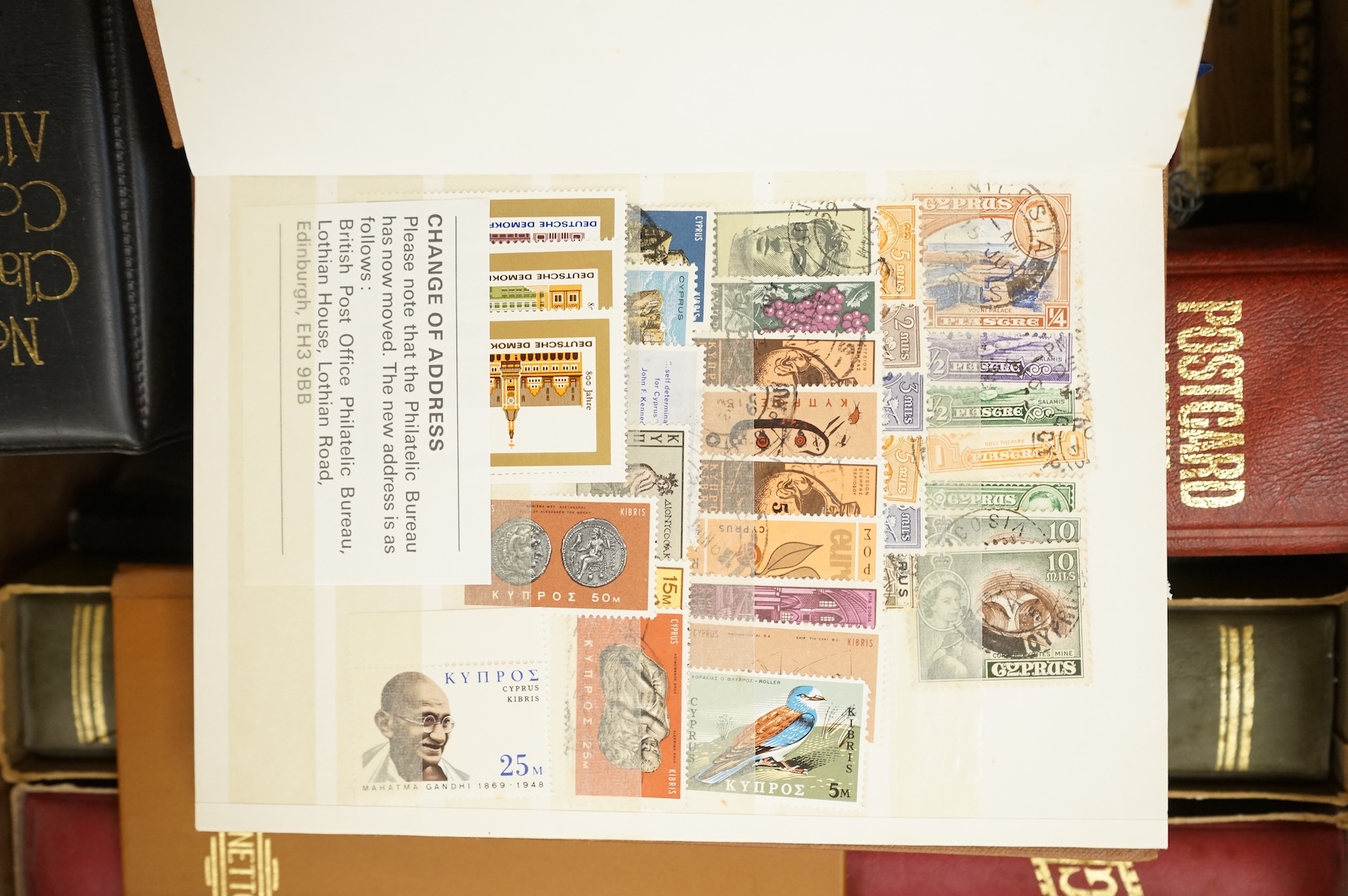 A collection of various stamps, mostly in albums